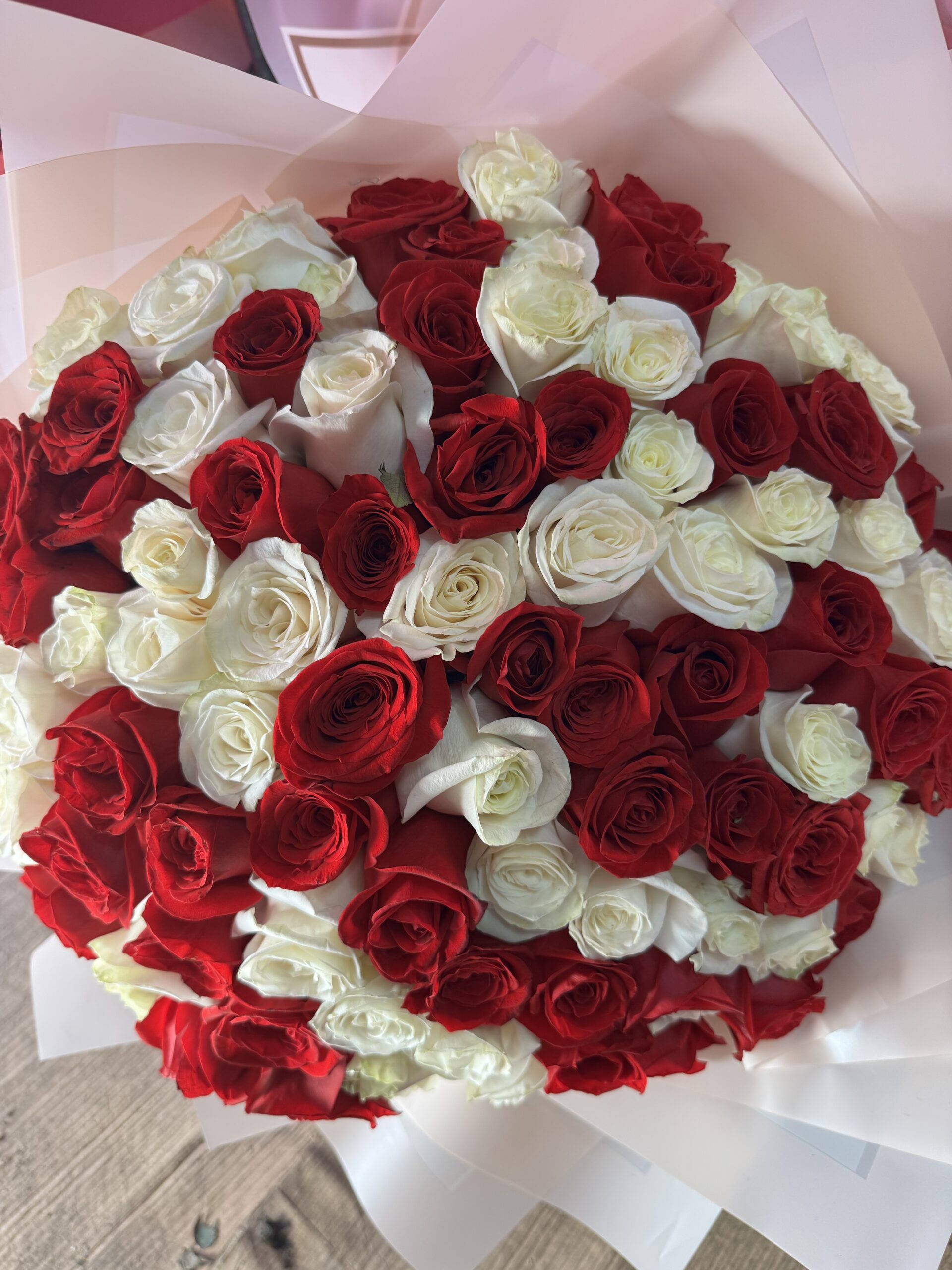 A bouquet of 75 roses by Fleur Sisters