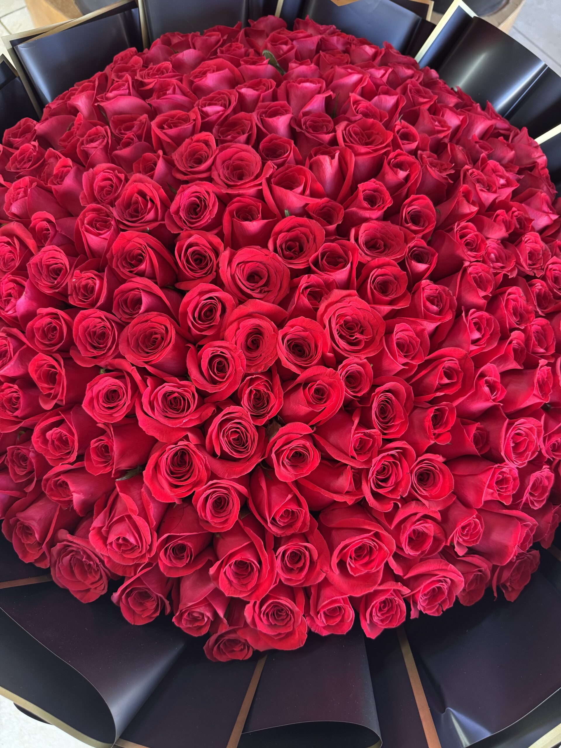 A massive hand-tied pink rose bouquet by Fleur Sisters